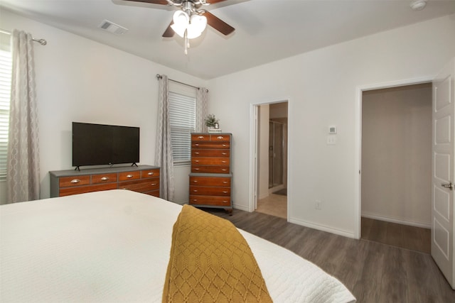 bedroom featuring connected bathroom, ceiling fan, and dark hardwood / wood-style floors