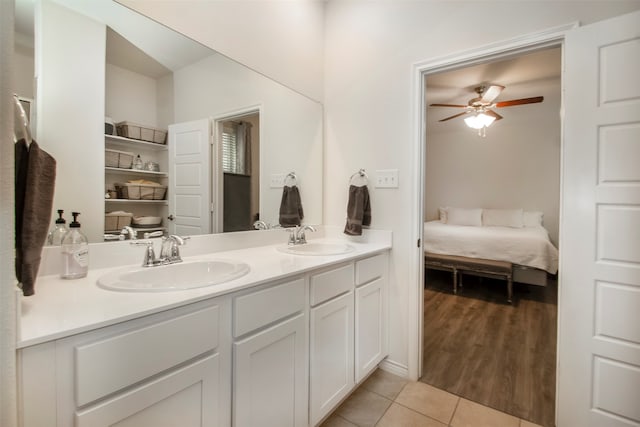 bathroom with vanity, hardwood / wood-style flooring, and ceiling fan