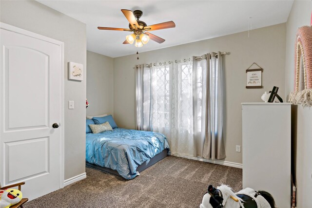 carpeted bedroom featuring ceiling fan