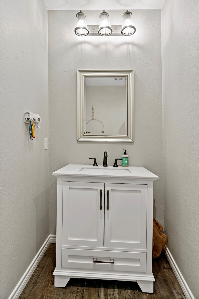 bathroom featuring wood-type flooring and vanity