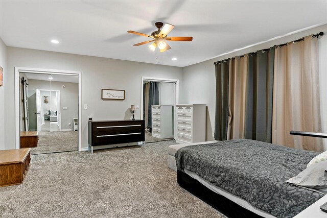 carpeted bedroom with a closet and ceiling fan