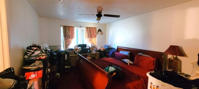 bedroom featuring a textured ceiling and ceiling fan