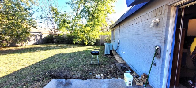 view of yard featuring central air condition unit