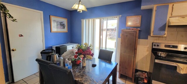 dining space featuring light tile patterned floors