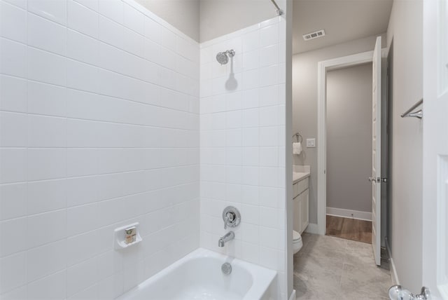 full bathroom featuring shower / bathing tub combination, tile patterned flooring, vanity, and toilet