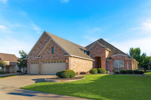 front of property with a front lawn and a garage