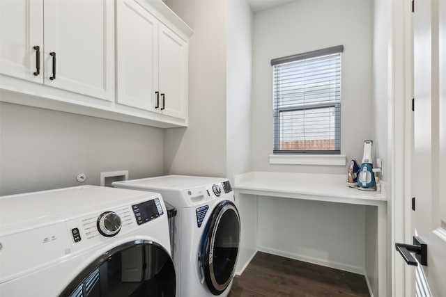 clothes washing area with dark hardwood / wood-style flooring, cabinets, and independent washer and dryer