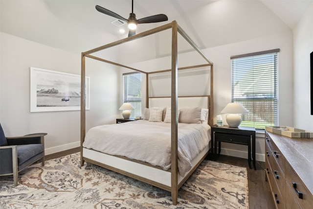 bedroom with ceiling fan, lofted ceiling, and light wood-type flooring