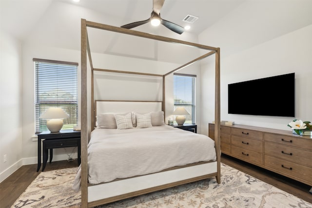 bedroom featuring multiple windows, vaulted ceiling, and ceiling fan