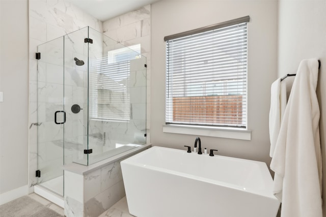 bathroom with shower with separate bathtub