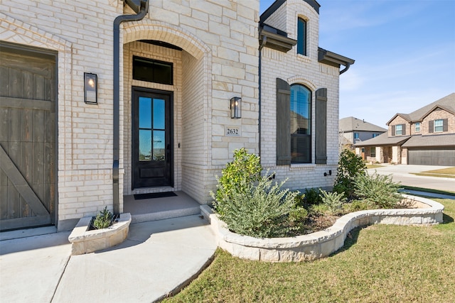 property entrance with a garage