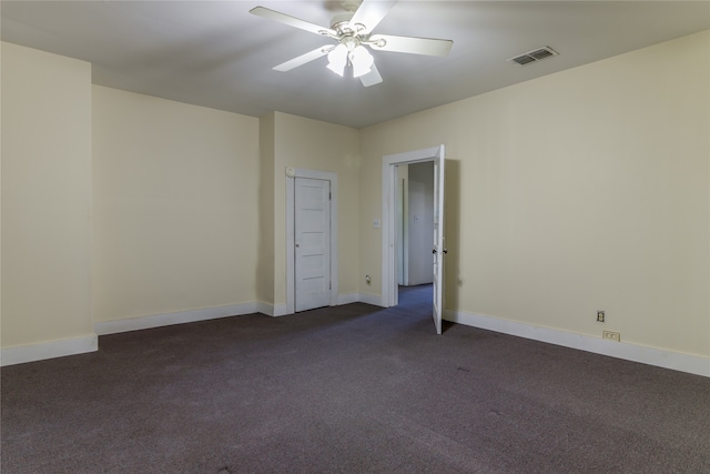 carpeted empty room featuring ceiling fan