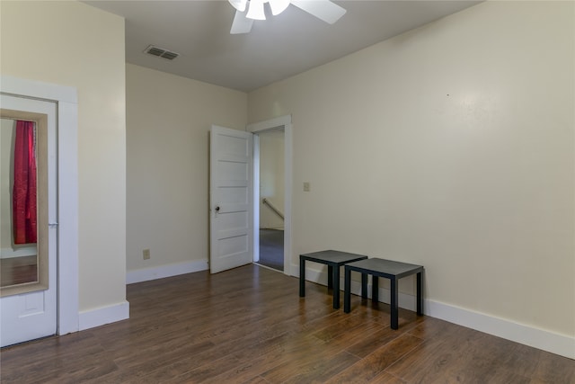 unfurnished room with ceiling fan and dark hardwood / wood-style floors