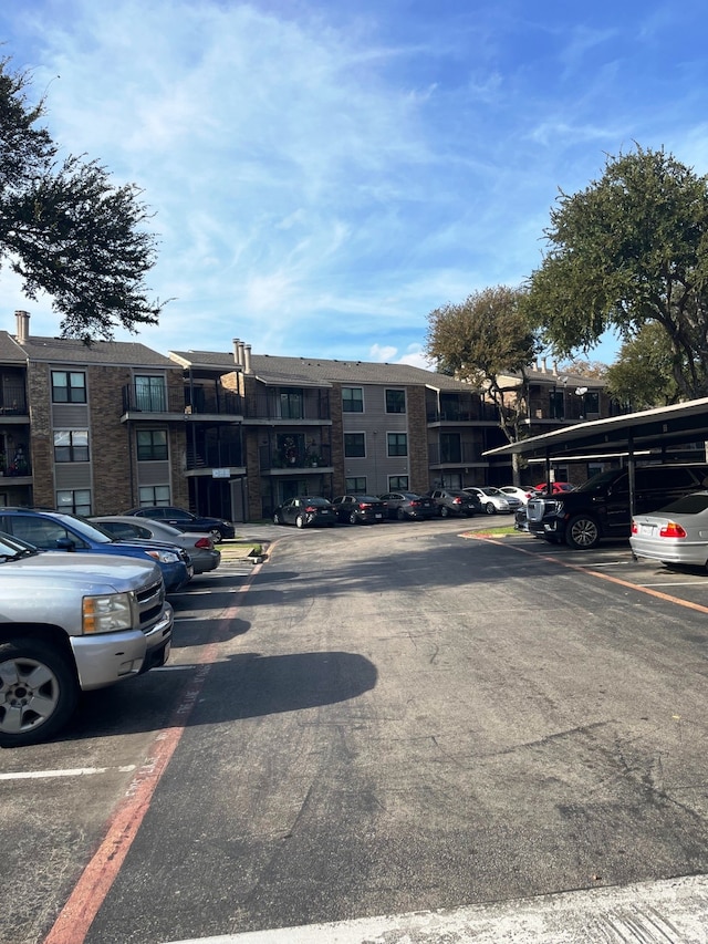 view of vehicle parking featuring a carport