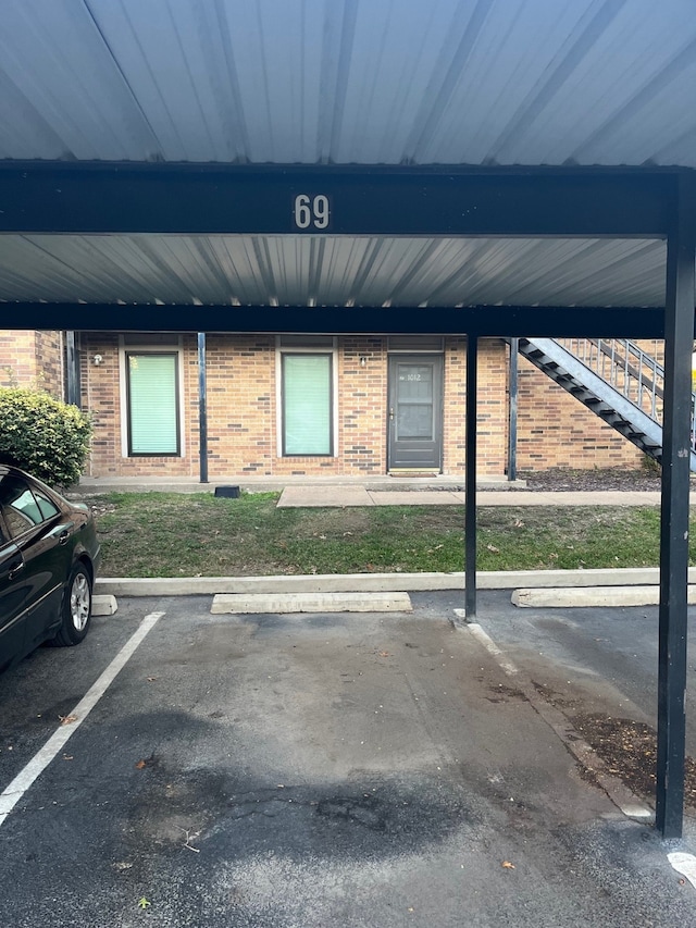 exterior space with a carport