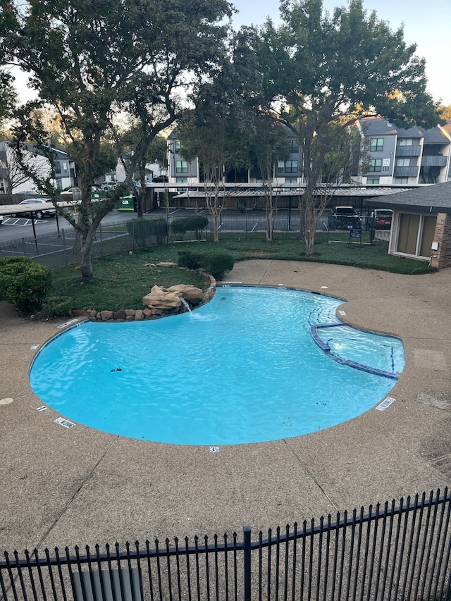 view of swimming pool featuring a patio area and pool water feature