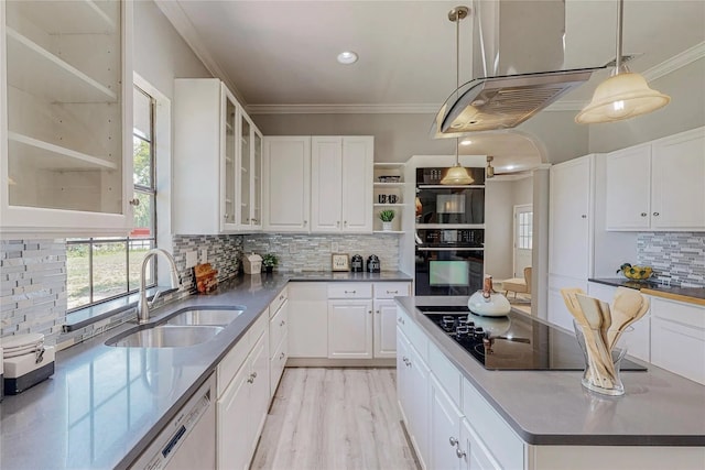 kitchen featuring decorative backsplash, white cabinetry, sink, and pendant lighting