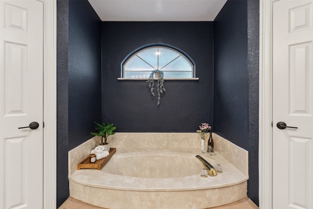 bathroom with a washtub