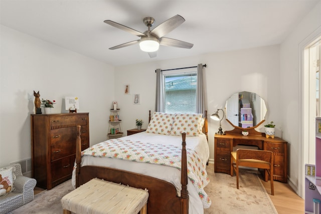 bedroom with ceiling fan and light hardwood / wood-style floors