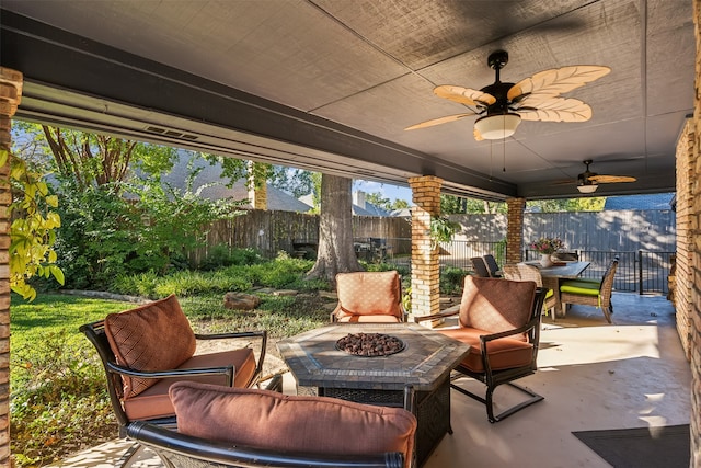 view of patio featuring a fire pit and ceiling fan