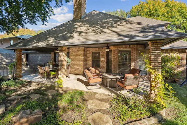 rear view of house featuring a patio area, ceiling fan, and an outdoor living space with a fire pit