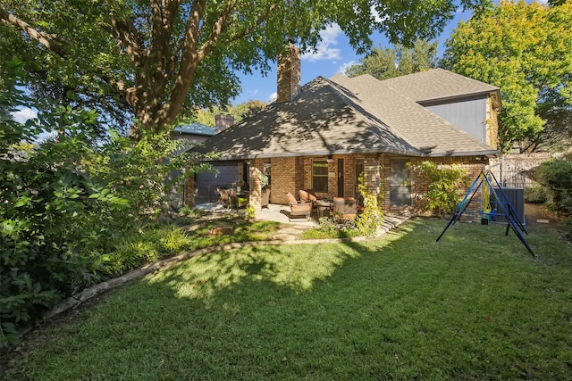 back of house featuring a yard and a patio