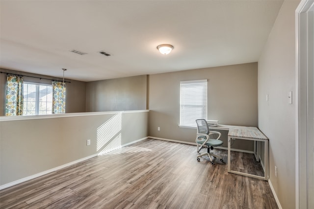 office with light wood-type flooring