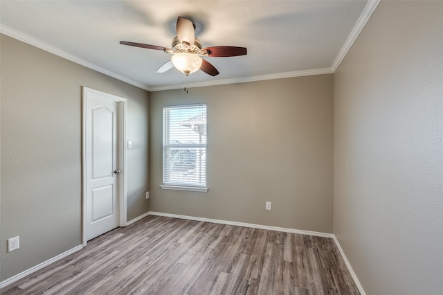 empty room with crown molding, ceiling fan, and light hardwood / wood-style floors