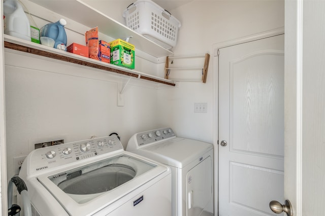 laundry room featuring washer and clothes dryer