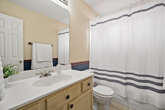 full bathroom featuring tile patterned flooring, vanity, toilet, and shower / bath combo