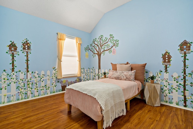 bedroom featuring hardwood / wood-style flooring and vaulted ceiling