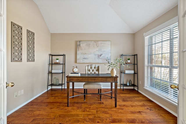 office featuring a textured ceiling, vaulted ceiling, and hardwood / wood-style flooring