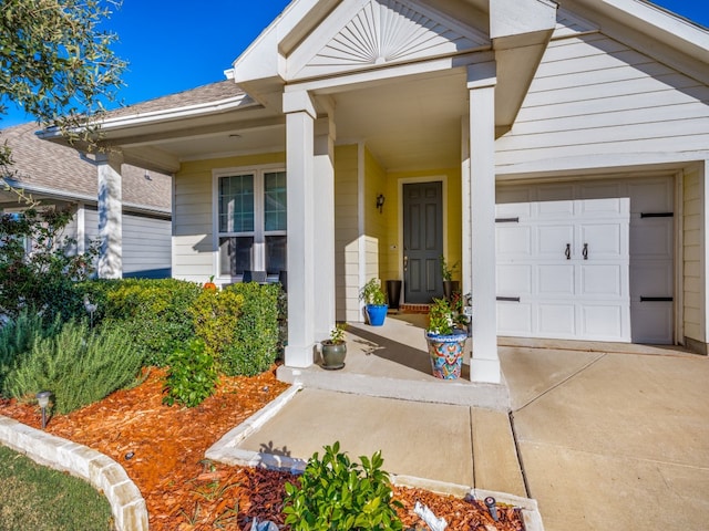 doorway to property with a garage