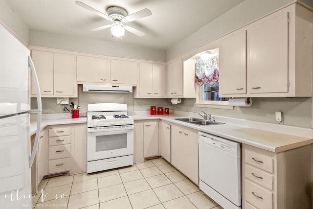 kitchen featuring ceiling fan, sink, white appliances, light tile patterned floors, and exhaust hood