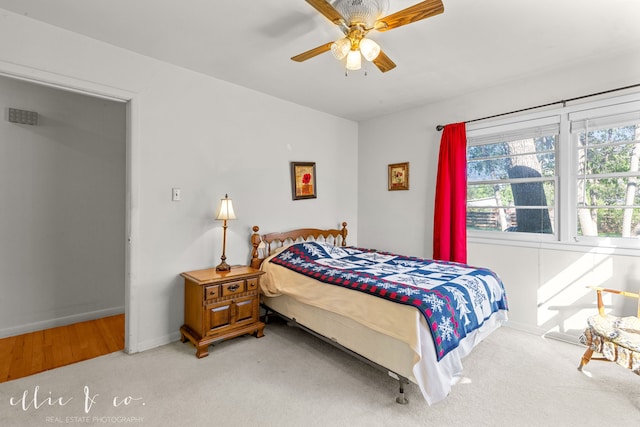 carpeted bedroom with ceiling fan