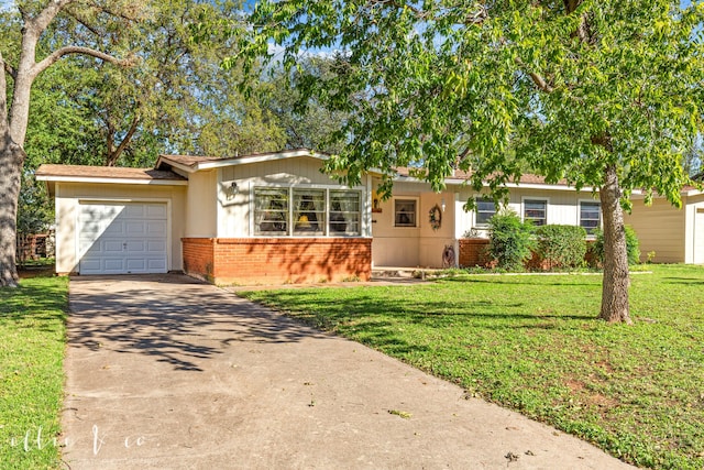 ranch-style house featuring a front yard and a garage