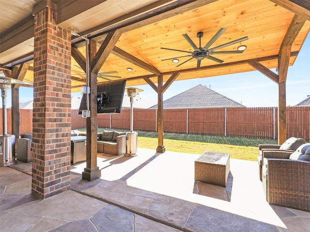 view of patio / terrace with a gazebo, an outdoor hangout area, and ceiling fan