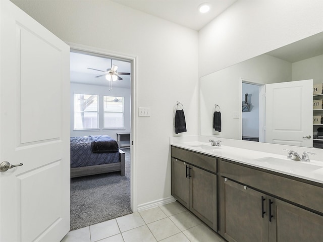 bathroom with ceiling fan, tile patterned flooring, and vanity