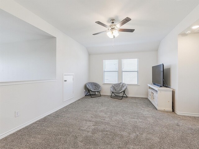 unfurnished room with lofted ceiling and light carpet