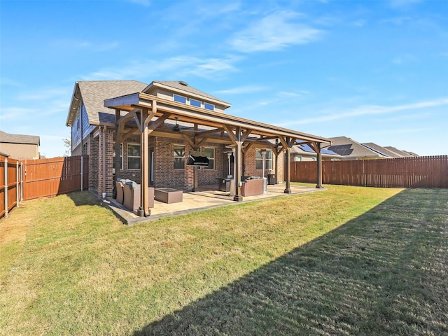 1013 Saddle Club Way, Princeton, TX 75407 - back of property featuring a fenced backyard, brick siding, a patio area, and a shingled roof