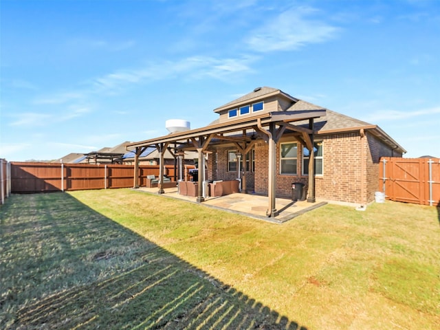 back of house with a patio area and a lawn