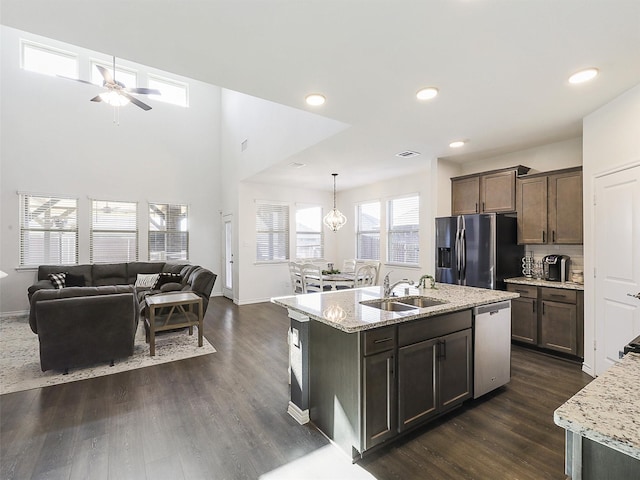 1013 Saddle Club Way, Princeton, TX 75407 - kitchen with stainless steel appliances, dark wood-style flooring, open floor plan, a ceiling fan, and recessed lighting