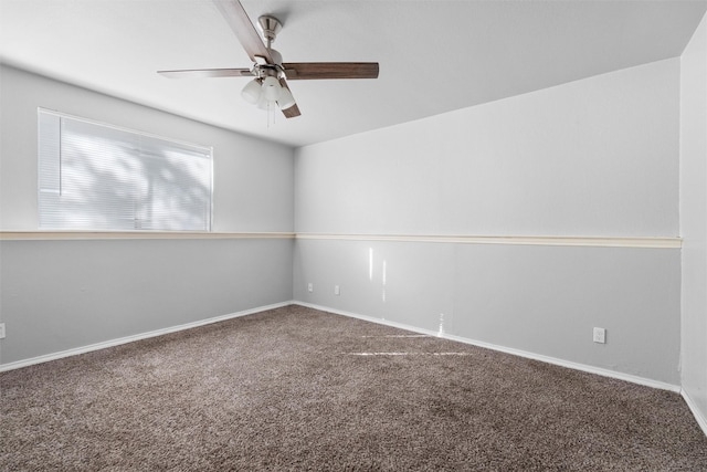 unfurnished room featuring ceiling fan and carpet floors