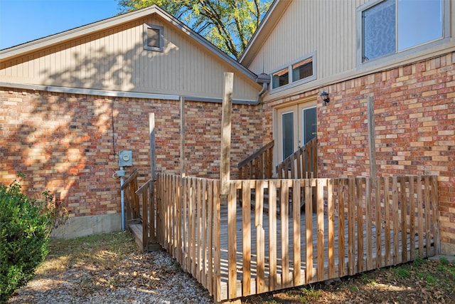 view of home's exterior featuring a wooden deck