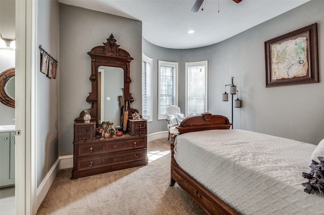 bedroom with light colored carpet and ceiling fan