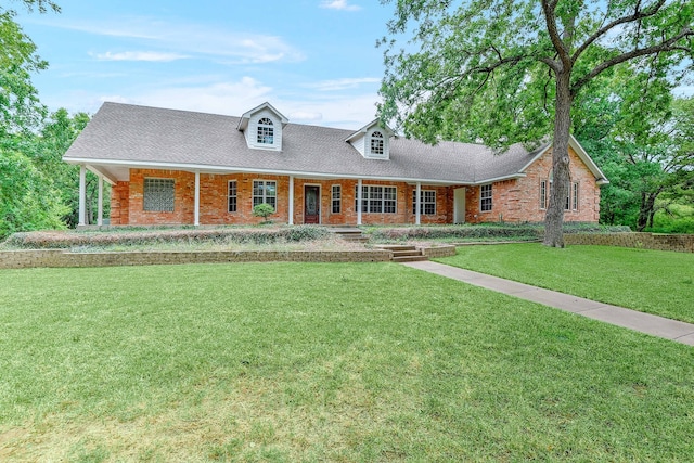 new england style home with a front lawn and a porch