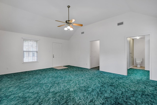 spare room with carpet flooring, high vaulted ceiling, and ceiling fan