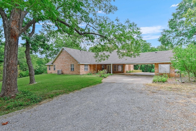 ranch-style home featuring central AC and a front lawn