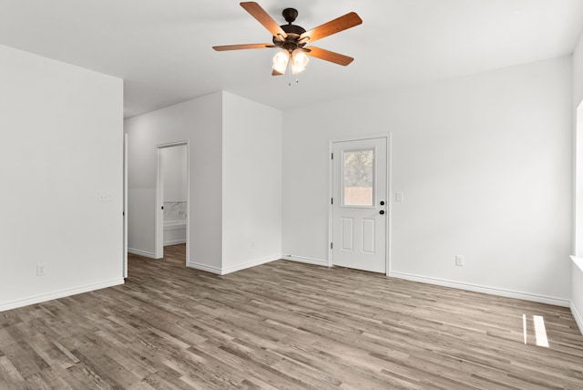 unfurnished room with ceiling fan and light hardwood / wood-style floors