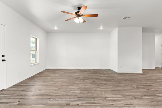 unfurnished room featuring ceiling fan and light wood-type flooring